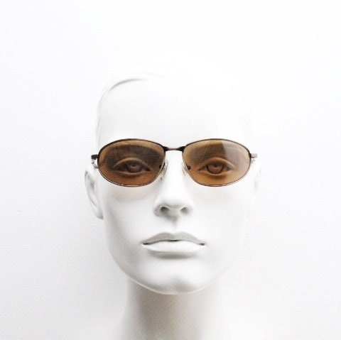 Y2K vintage small bug eye aviator sunglasses. Curved copper brushed finish solid metal frame with tortoise arms. Unused 2000s NOS