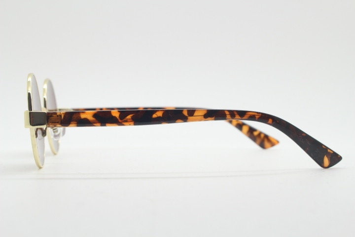 90s round vintage sunglasses. Gold 1920's style frame with tortoise arms and brown lenses. Unused. NOS. Steampunk