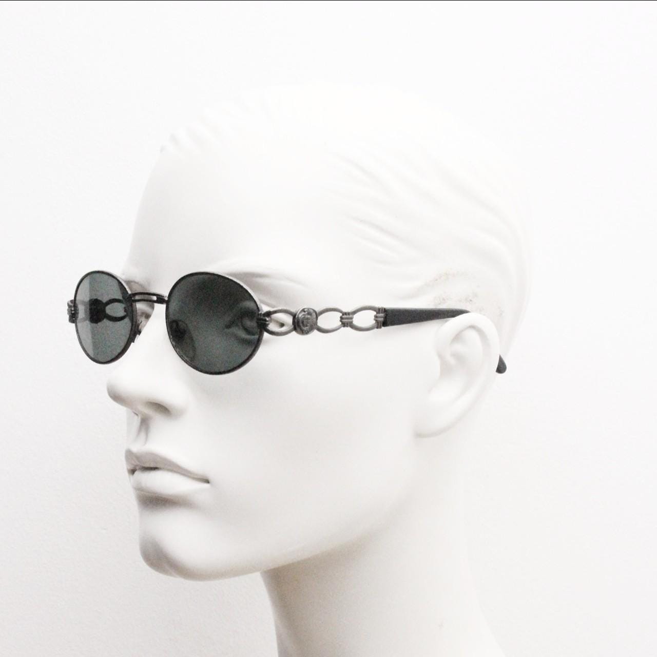 90s vintage low profile oval sunglasses. Authentic Gunmetal grey satin finish frame with chain link arm circles and real glass lenses. NOS