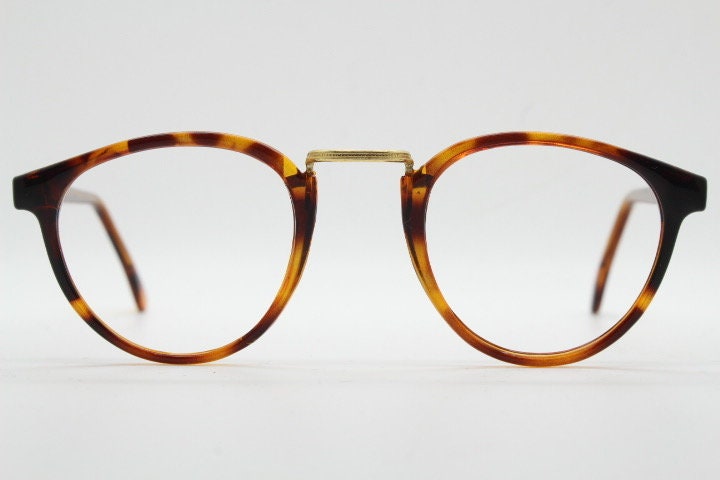 90s vintage round eye glasses. Minimal slim tortoise optical frames with gold bridge. 40s, 50s design prescription eyeglasses. RX spectacles