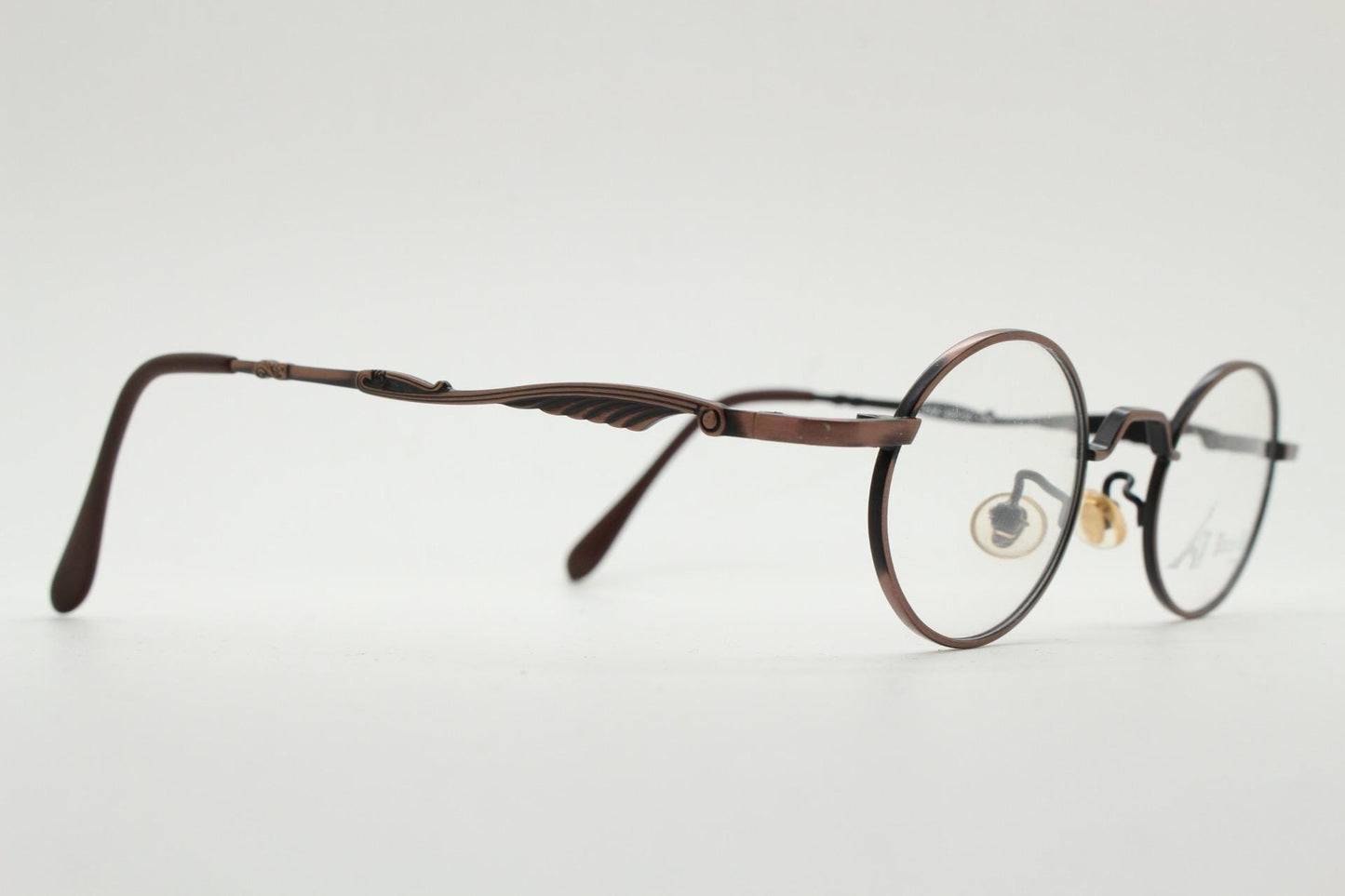 Paris Ma 90s vintage small oval eye glasses. Brushed bronze optical frames with scrolled arm details. Prescription. Steampunk spectacles NOS