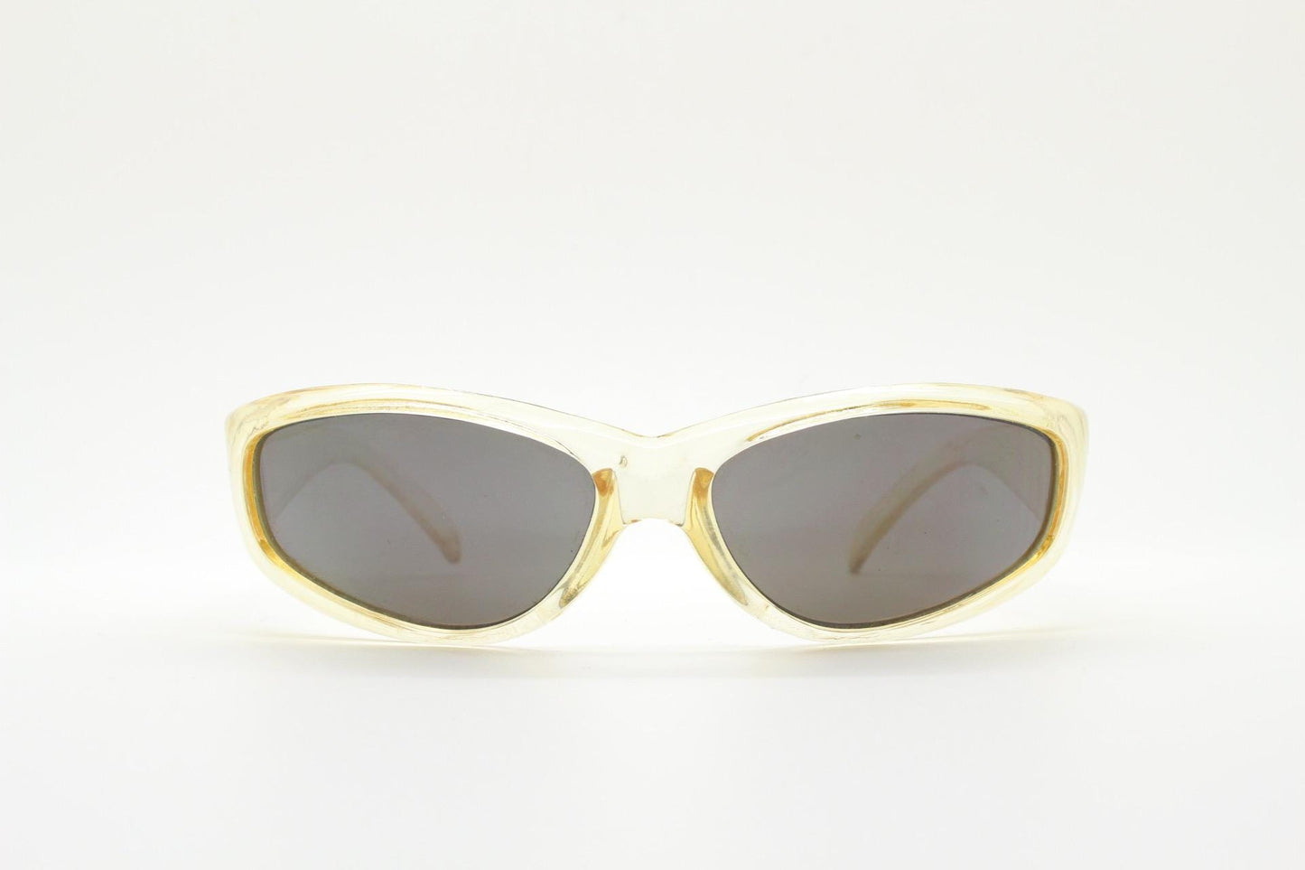 90s vintage sports shield sunglasses. Transparent yellow aerodynamic curved wraparound frame with contrasting black lenses. 2000's rave