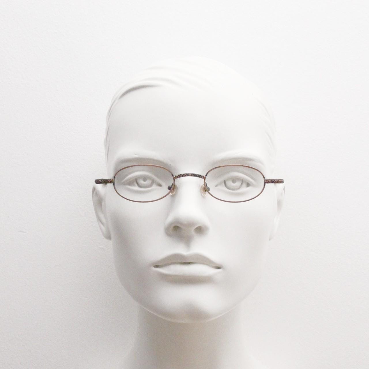 Paris Ma 90s vintage small oval eye glasses. Brushed copper finish optical frames with ornate details. Prescription steampunk spectacles NOS