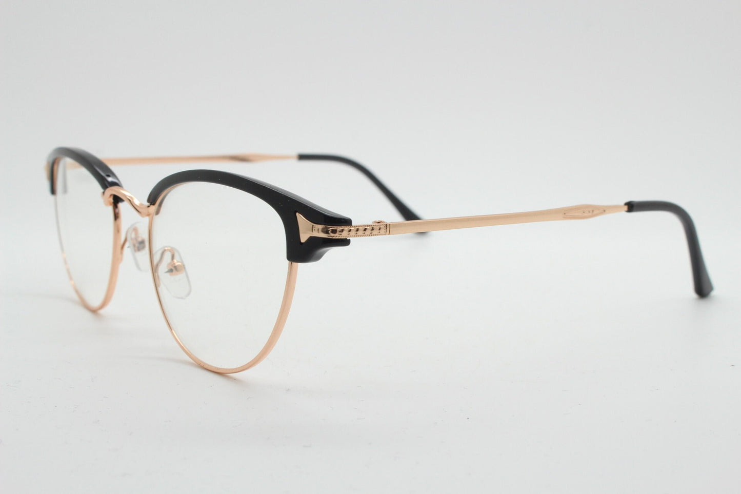 90s vintage browline cat eye glasses. Black gloss and gold half frame eyeglasses. 50s, 60s cateye design with clear lenses. NOS