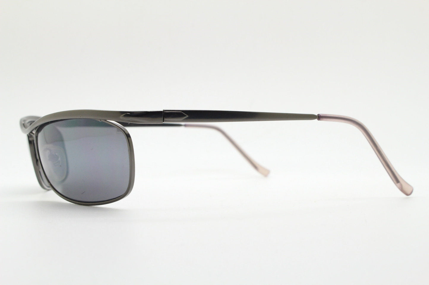 Y2K vintage curved oval sunglasses. Minimal grey chrome metal aerodynamic sport shaped frame. 2000's. 00's NOS
