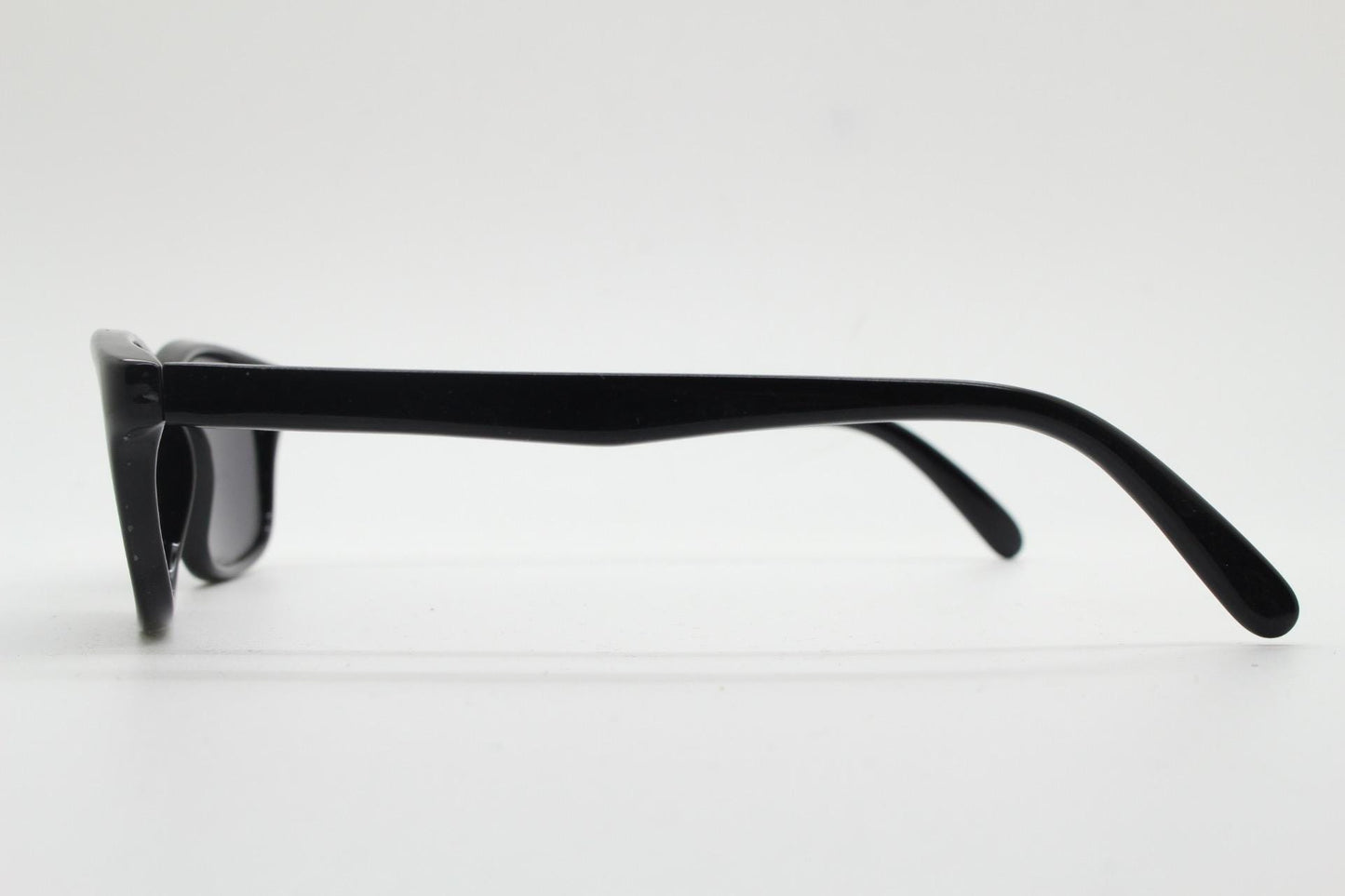 Vintage 90s slim rectangular modified wayfarer design sunglasses made in Italy. All black gloss low profile acetate frame. Unused NOS
