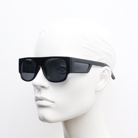Y2K vintage rectangular side panel sunglasses. Black gloss frame with grey lenses and side window spoilers / blinkers. 2000s NOS goggle