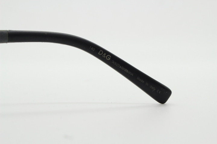 Dolce and Gabbana gum sunglasses made in Italy. Mens 90s vintage innovative flexible grey rubber frame with black lenses