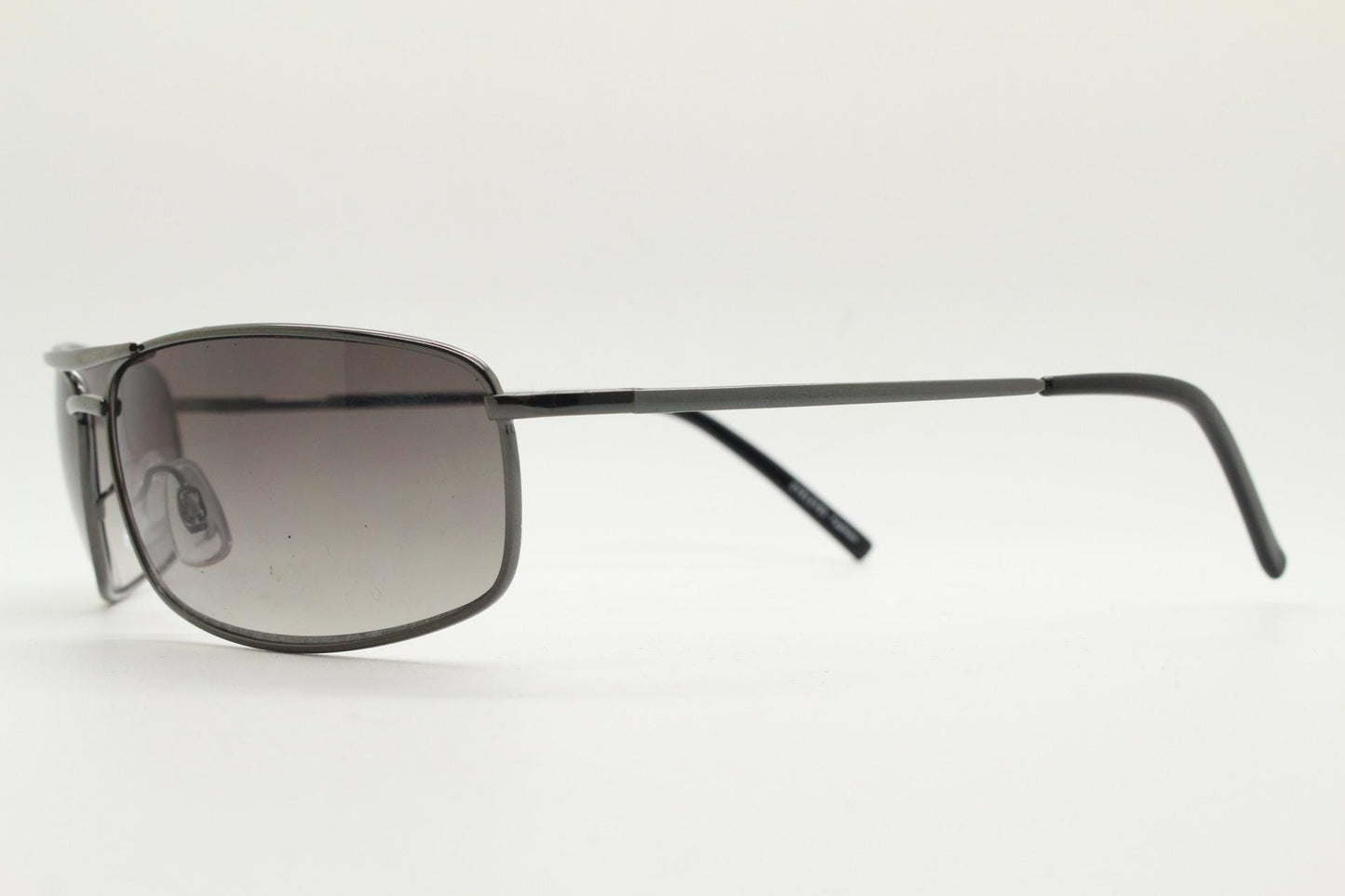 90s vintage rectangular wrap around sunglasses. Gunmetal chrome curved frame aviators with light tone gradient lenses. Unused NOS