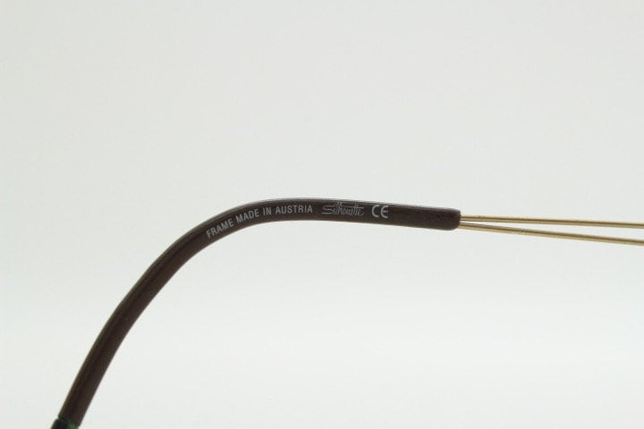 Silhouette rectangular frameless eye glasses model 7677 made in Austria. Minimal lightweight optical frame with golden trim. Prescription RX