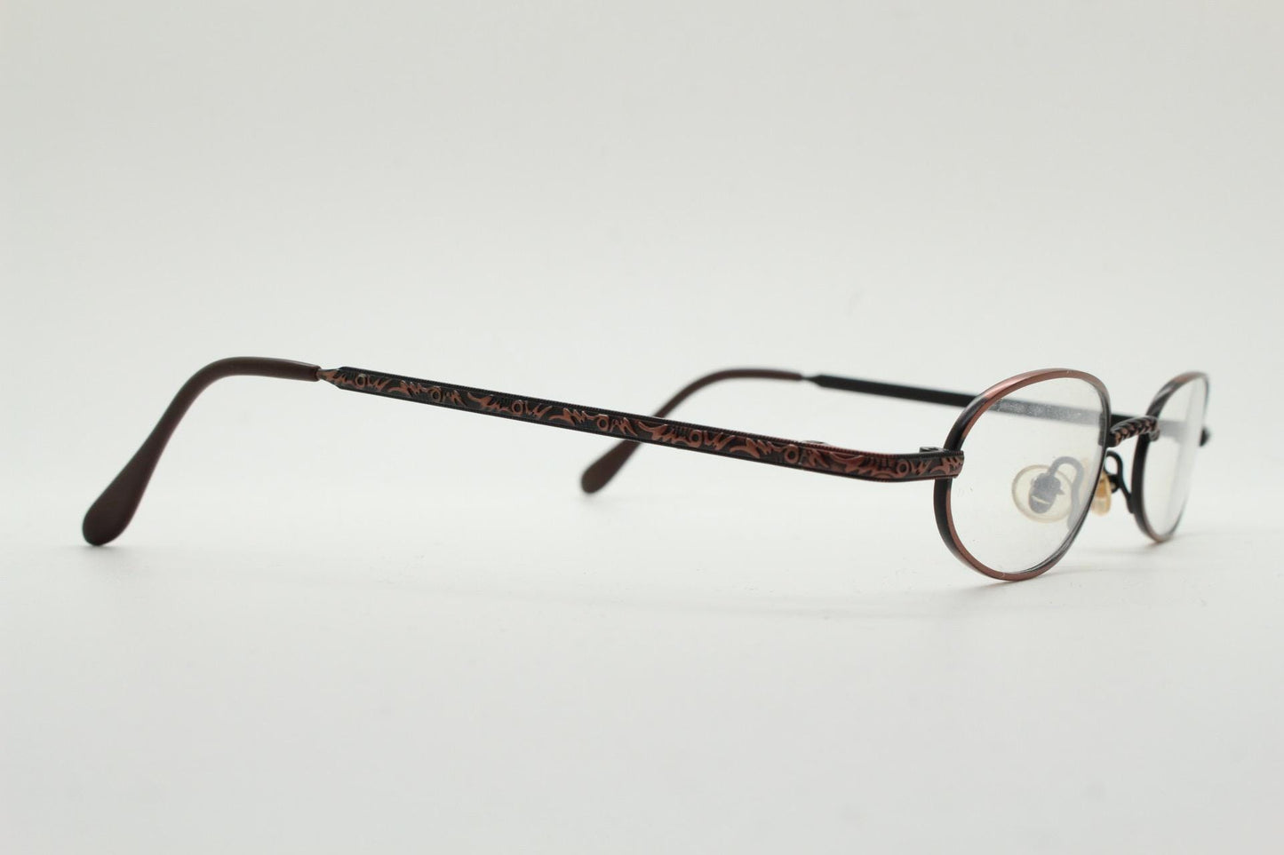 Paris Ma 90s vintage small oval eye glasses. Brushed copper finish optical frames with ornate details. Prescription steampunk spectacles NOS