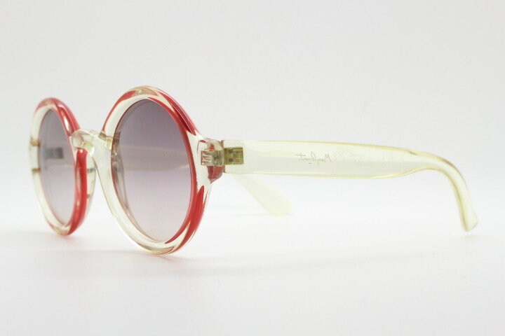 Mary Quant 60s vintage round sunglasses made in France. Yellow crystal transparent lucite frame in with contrasting dark graduating lenses