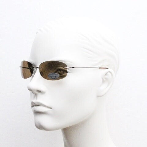 Faconnable 90s vintage sunglasses model 859 hand made in Italy. Minimal frameless design with flexible wire arms and brown chrome trim. NOS