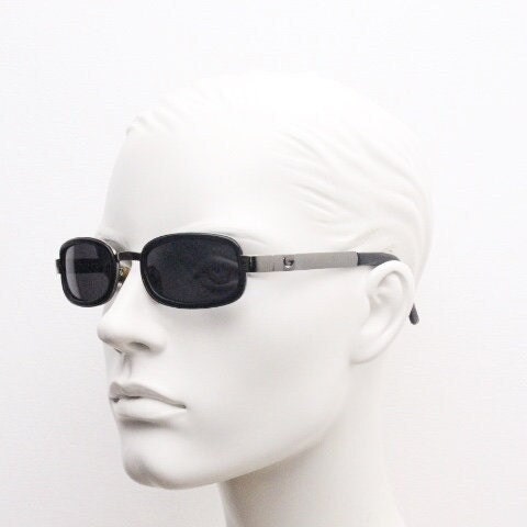 Byblos 90s vintage low profile rectangular sunglasses made in Italy. Gunmetal grey chrome frame with black insets and cut out arm logo's