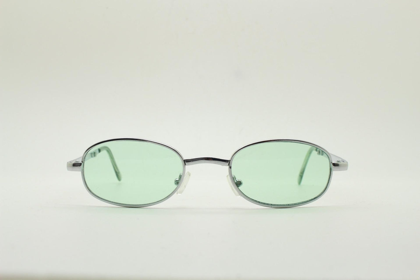 90s micro foldable oval sunglasses. Light green lenses in a small silver folding compact frame. Folder. Rave 2000s. Y2K. NOS