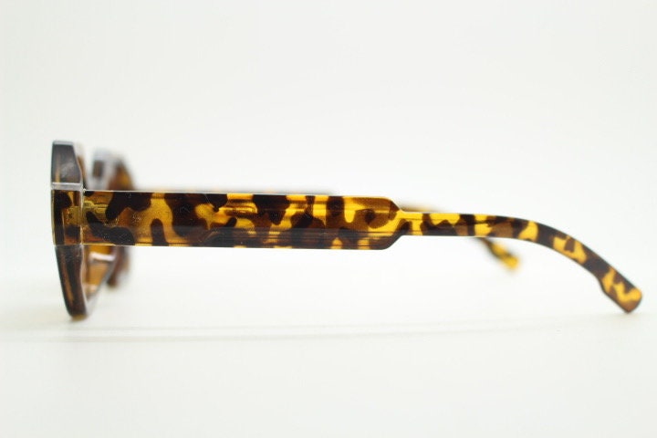 90s vintage hexagon sunglasses. 6 sided honey tortoise gloss chunky frame with graduating Havana brown lens tone. NOS