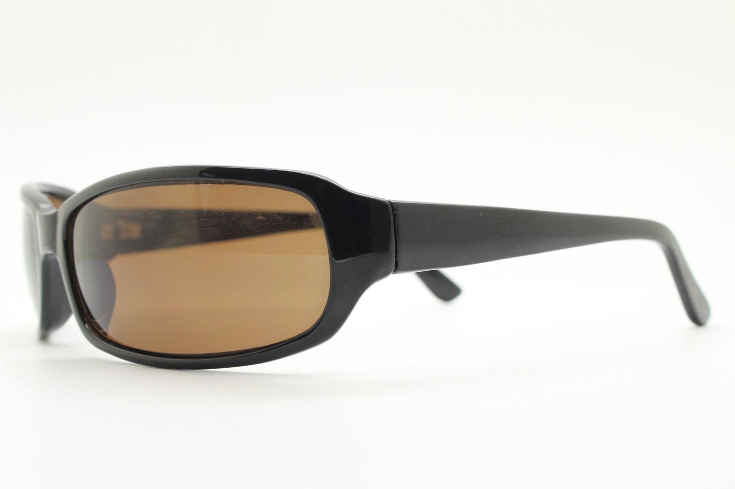 Y2k vintage wrap around rectangular sunglasses. Low profile curved black gloss frame with plain brown lenses. 2000's bug eye. NOS