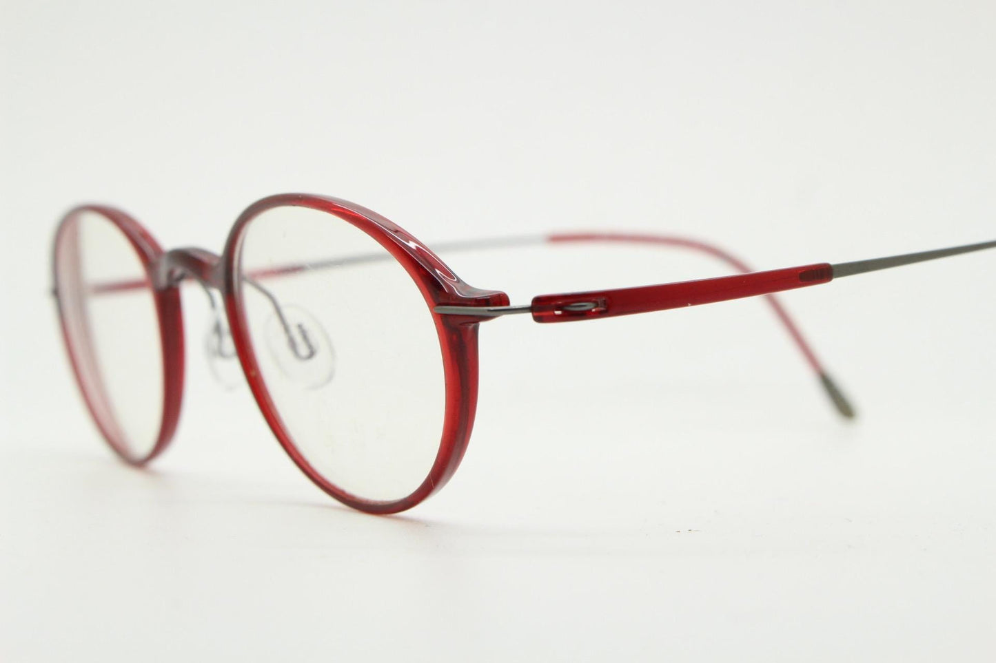 Silhouette rectangular frameless eye glasses made in Austria. Lightweight 1930s design with titanium. Red optical frame. Prescription RX