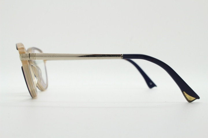 Nina Ricci vintage cat eye glasses. Yellow crystal and black acetate cateye optical frames gold metal arms. Womens prescription spectacles