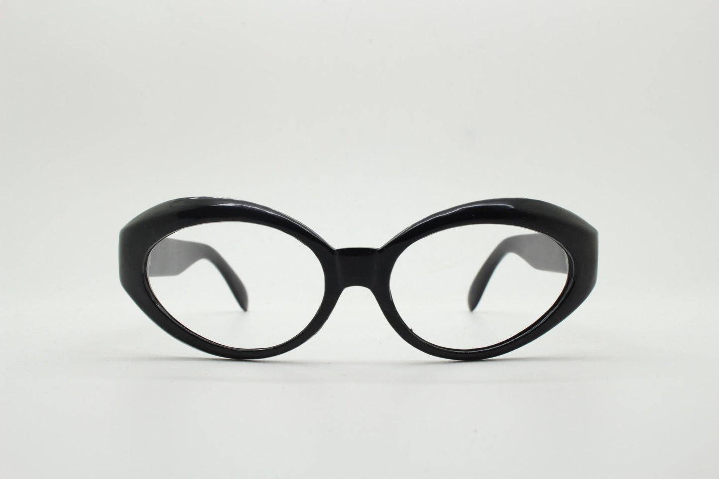 80s vintage oval cat eye glasses. Crop sided dynamic black cateye optical frames. 60s design prescription eyeglasses. RX spectacles. NOS