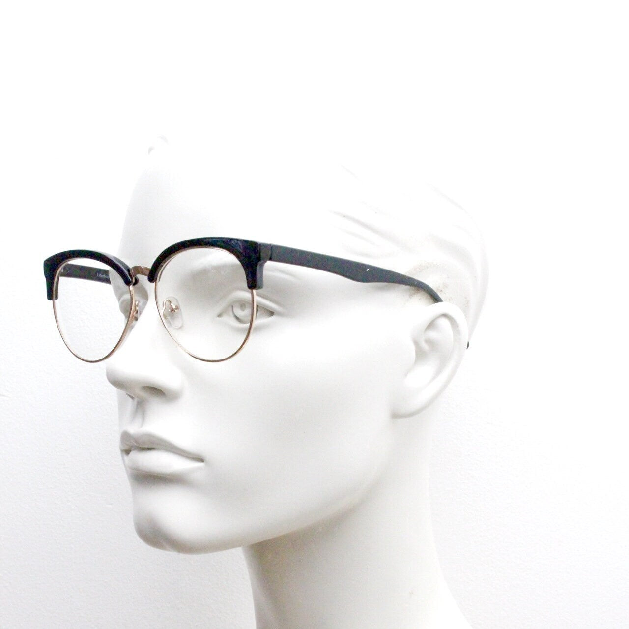 90s vintage modified cat eye glasses. Black gloss browline half frame eyeglasses with gold underwire. 50s, 60s design cateye. NOS