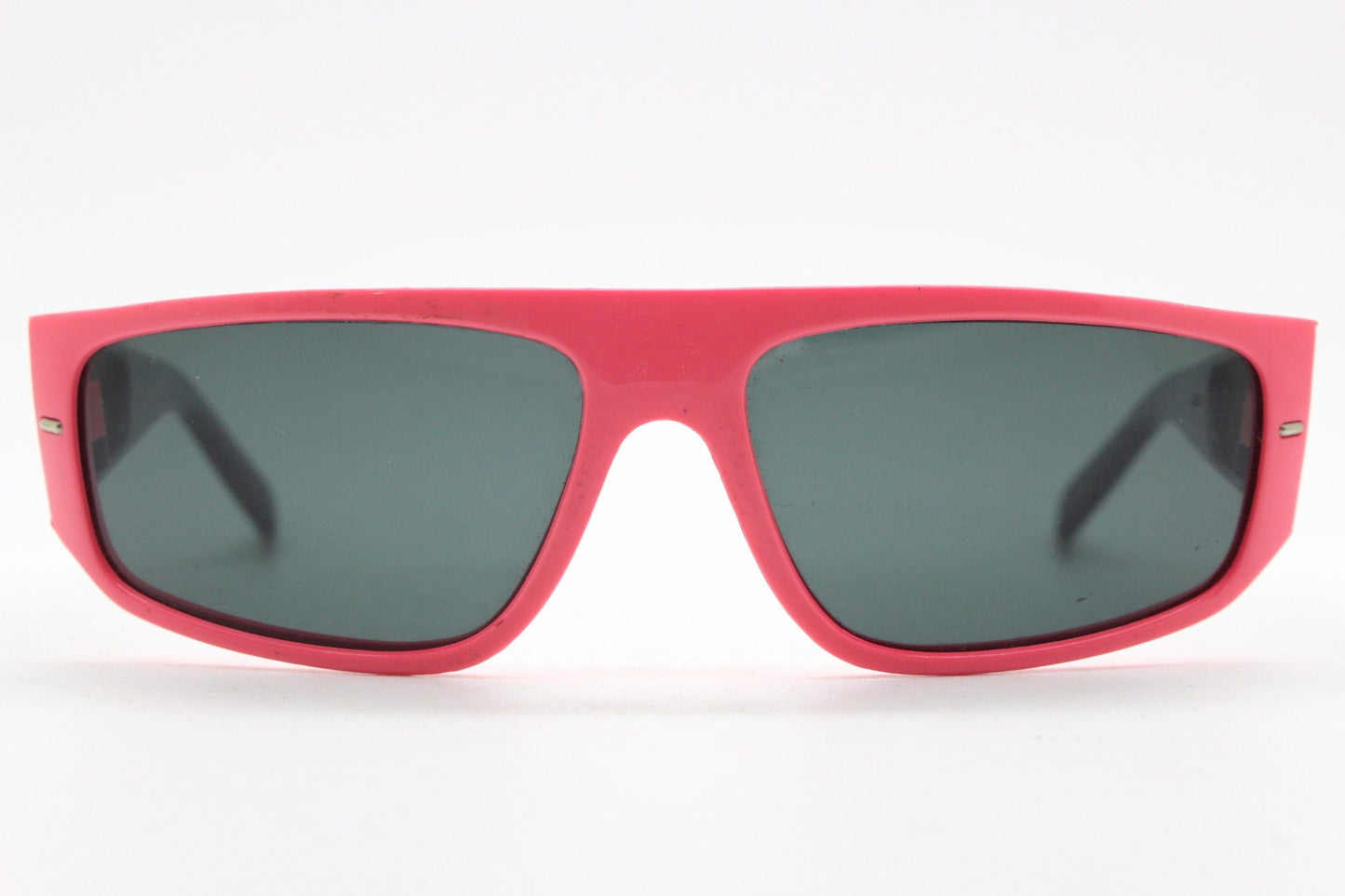 80s vintage 2 tone sunglasses. Aerodynamic flat top shield style wrap around frame in pink and black with real glass lenses. Unused NOS