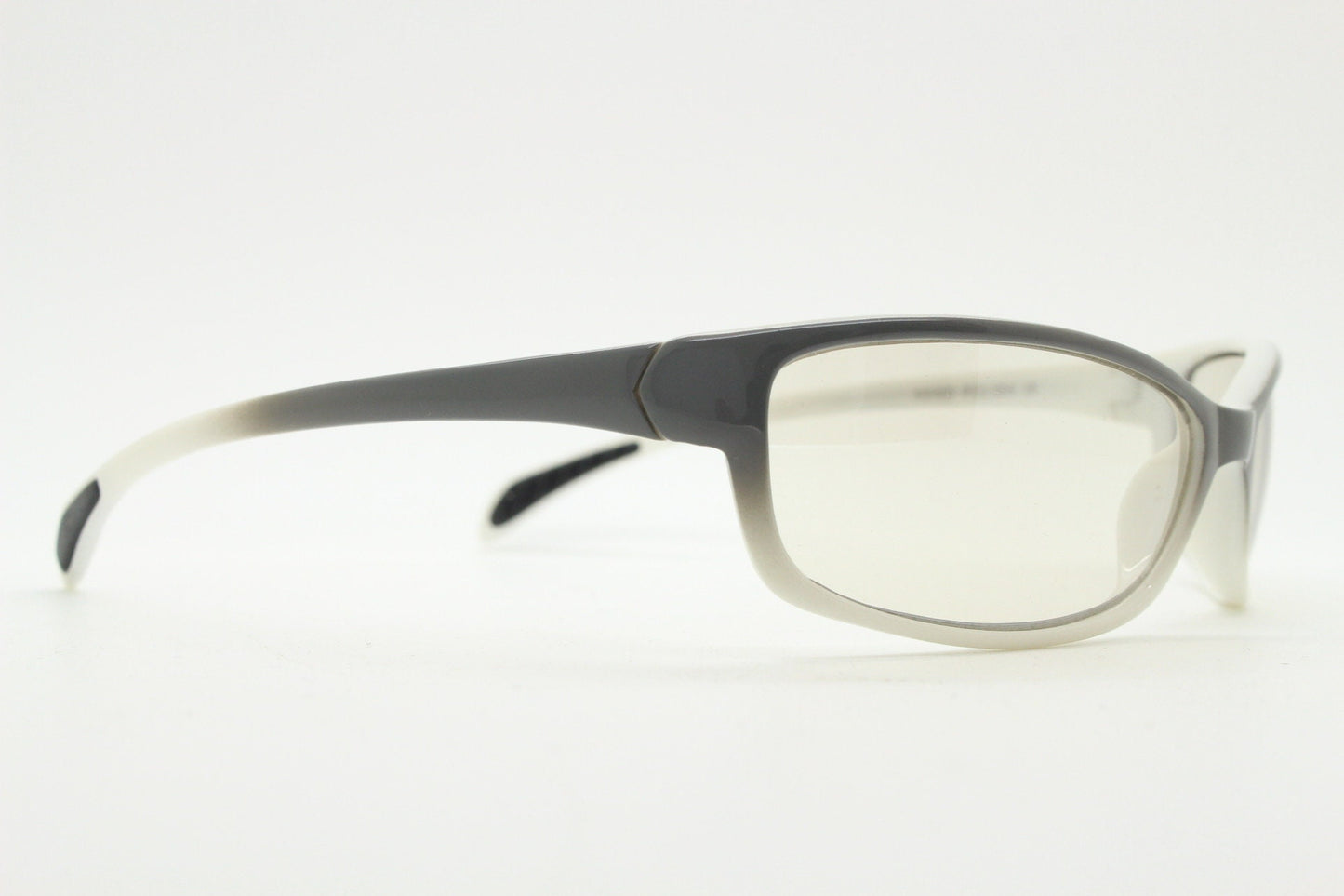 Y2K vintage futuristic sunglasses. Gloss white and grey wrap around shield style frame with light tone lenses. Cosplay visor. 2000s NOS