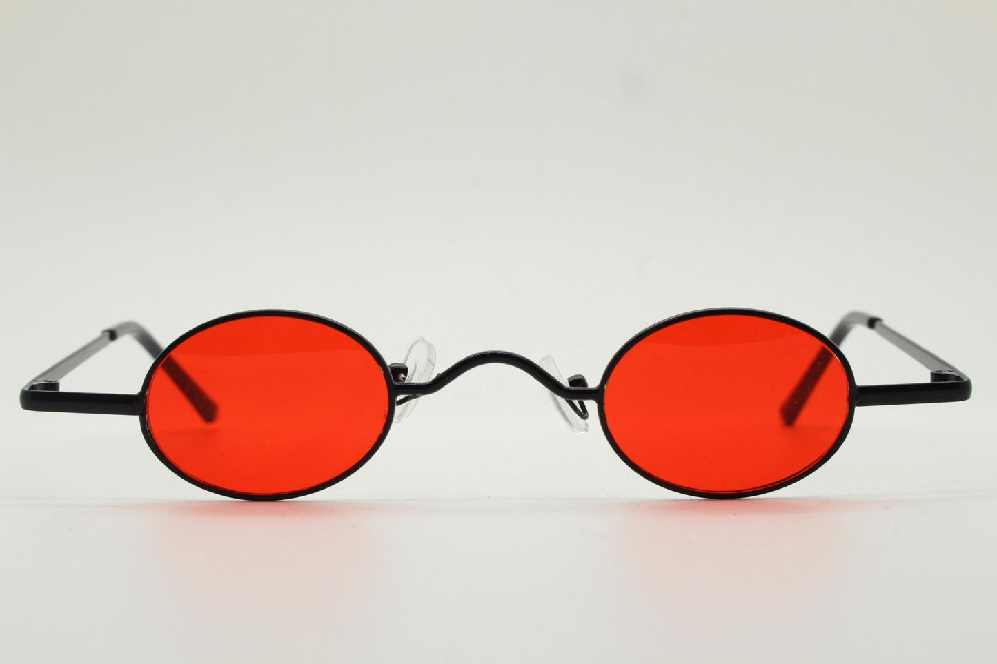 90s vintage small oval sunglasses. Imposing minimal black gloss metal victorian antique style frame with bright red lenses. Steampunk. NOS