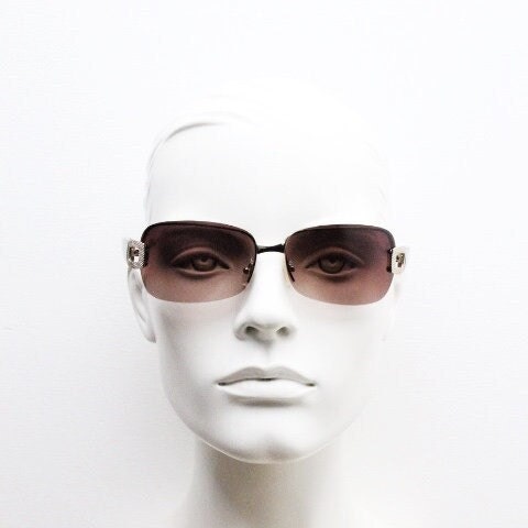 Y2K vintage rectangular brown sunglasses. Gold half frame 2000's wrap around with curved lenses, gold trim and temple crests. Unused NOS
