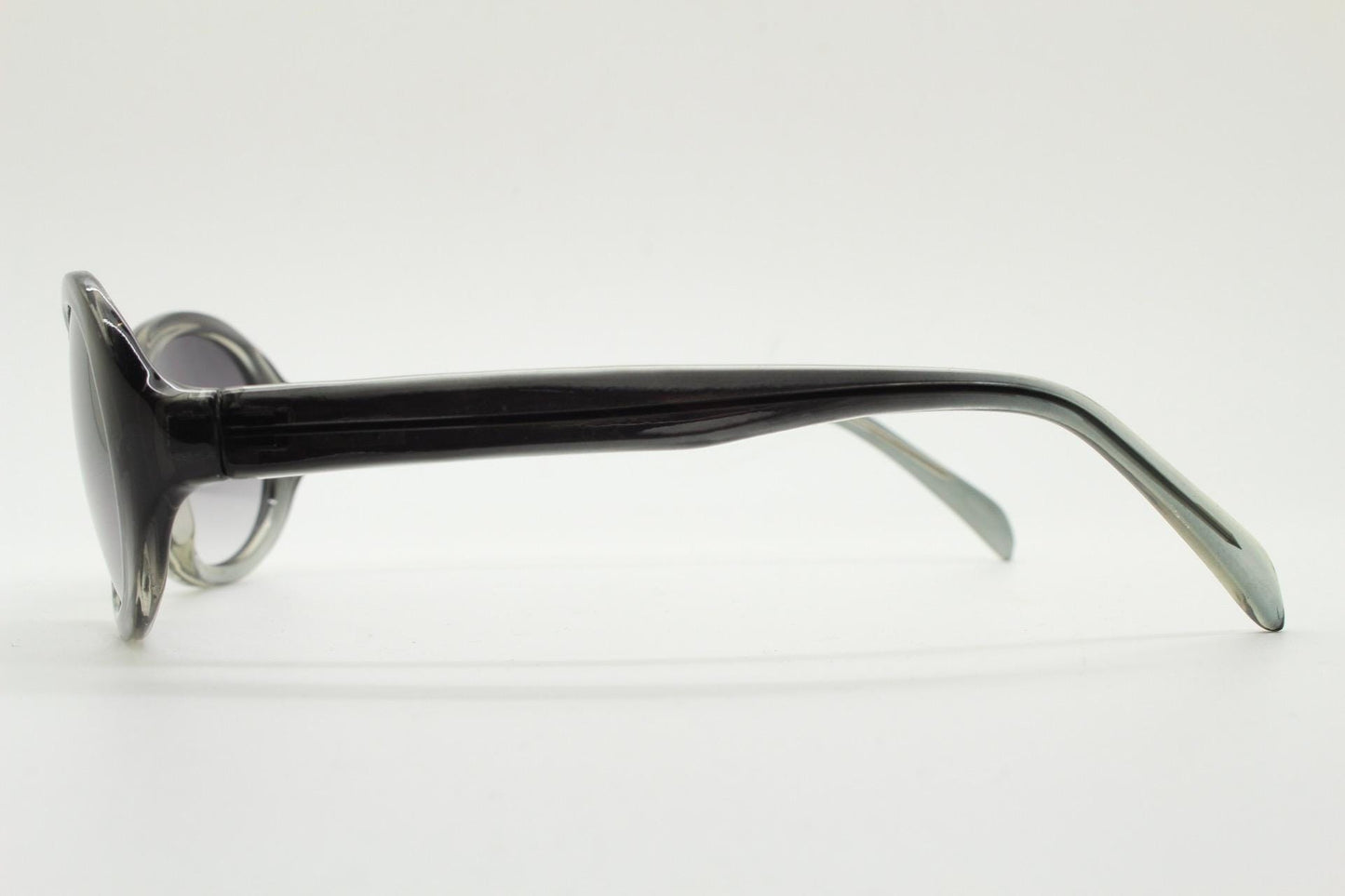 Y2K vintage oval bug eye sunglasses. Tasteful transparent grey acetate frame with matching graduated lenses. 2000s NOS. BNWT