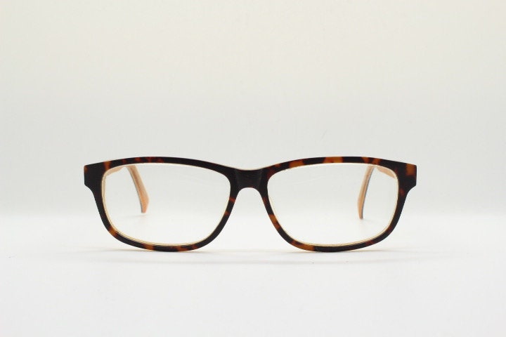 Cheap Monday rectangular low profile eye glasses. Brown and amber layered acetate optical frames. Prescription eyeglasses. RX spectacles