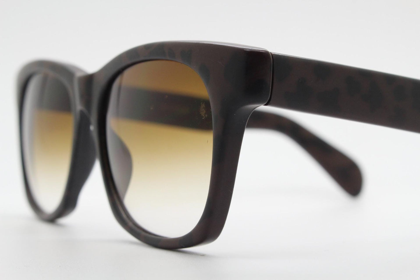 Vintage 80s square horn rim sunglasses. All time classic design in chunky matt black and brown frame with superb graduating lenses. NOS