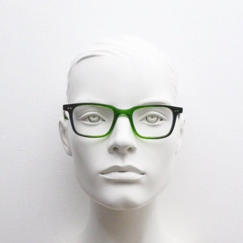 Green rectangular low profile wayfarer design eye glasses by found of Switzerland. Green gloss acetate optical frames. Prescription RX