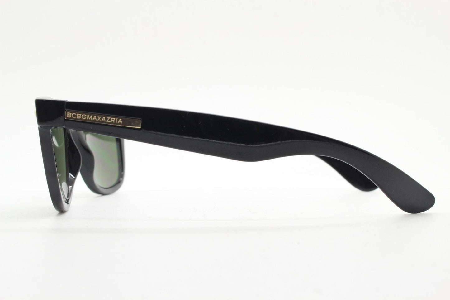 BCBG Max Azria vintage wayfarer design sunglasses. All time classic horn rim format in plain black gloss frame with green lenses.