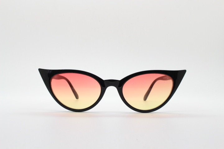 Y2K vintage pointed cat eye sunglasses. Womens black slender 50s design frame with pink to yellow ombre lenses. Rockabilly bad girl pin up