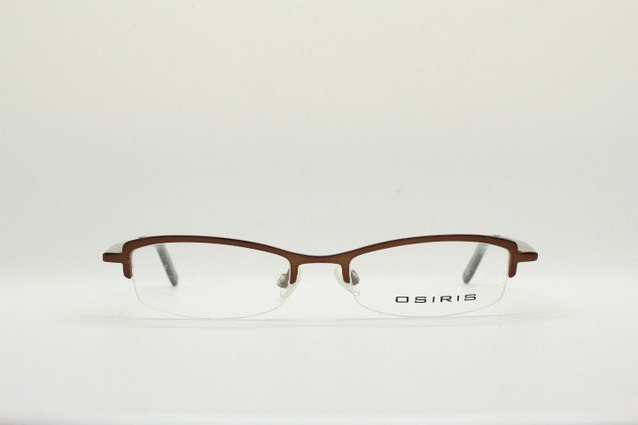 Osiris 90s vintage rectangular half rim eye glasses. Low profile optical frame in handsome brown chrome. Prescription RX Spectacles