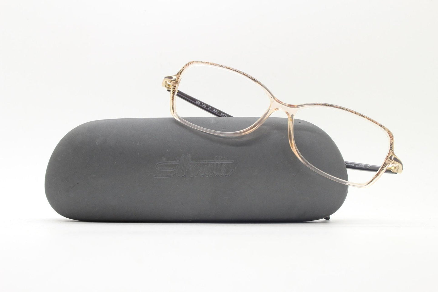 Silhouette 80s vintage oval eye glasses made in Austria. Transparent crystal optical frame with giraffe arm print. Prescription RX