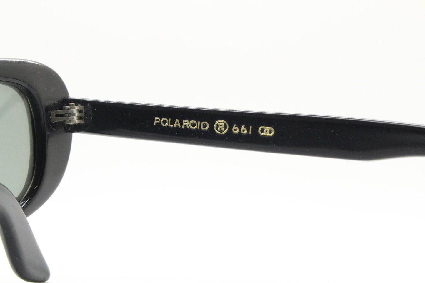 Polaroid 60s vintage rectangular sunglasses made in England. Authentic plain black frame with atmospheric curved lenses. Mens mod