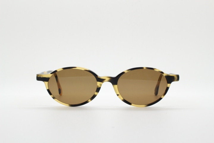 Robert La Roche 90s vintage oval sunglasses. Vibrant honey and mottled brown acetate undersized frame with plain brown lenses. NOS