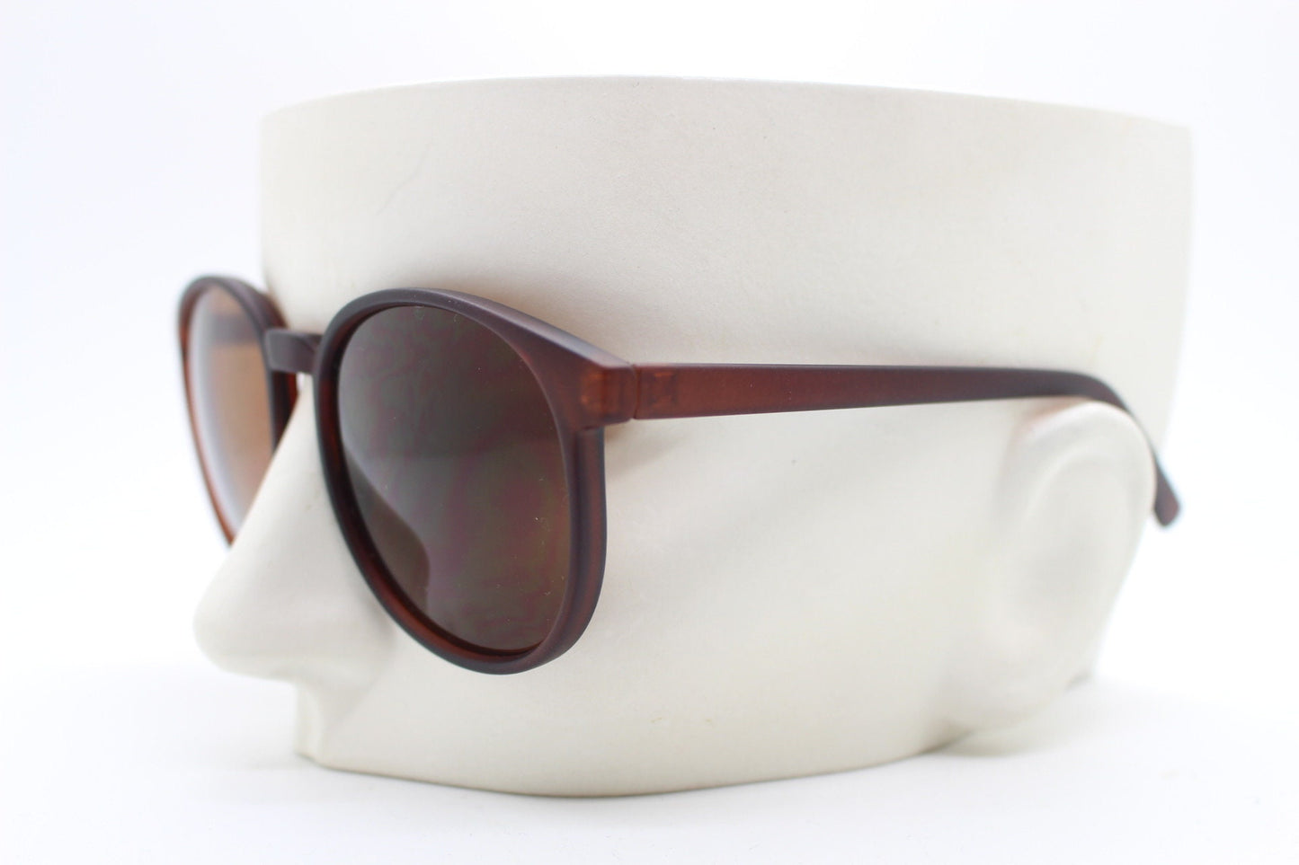 80s vintage round sunglasses. Slightly oversized slim transparent brown frame in a rubber finish with matching lenses. BNWT