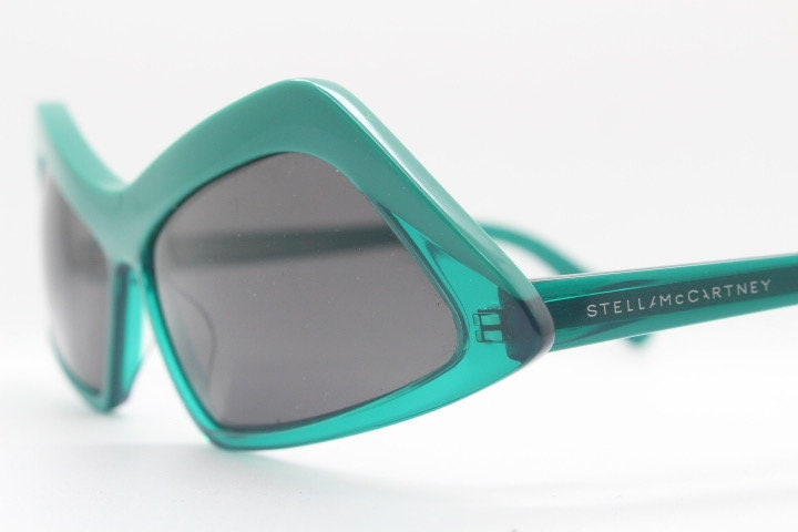 Stella Mc Cartney vintage abstract diamond sunglasses. Blockbuster fashion grail in transparent green acetate with dark lenses. NOS