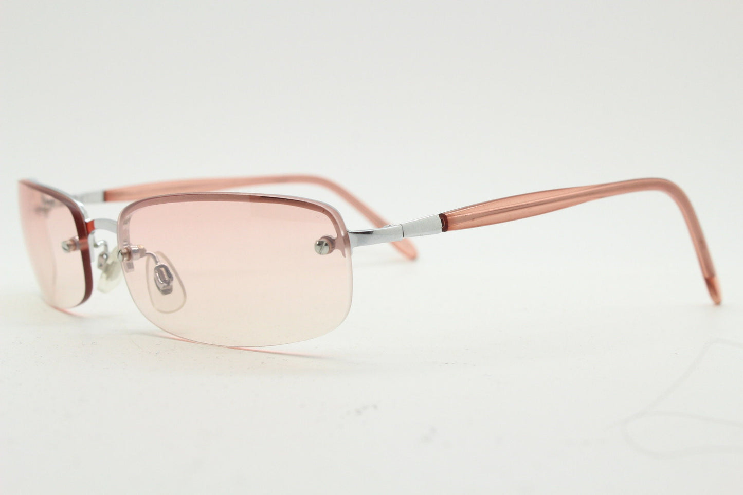 Y2K vintage wrap around rectangular sunglasses. Half frame in sharp chrome with extra light tone pink lenses. Rave 2000's. 00's NOS