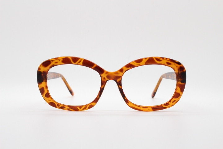90s vintage angular rounded eye glasses. Transparent vibrant amber giraffe pattern optical frame. Womens prescription eyeglasses. RX
