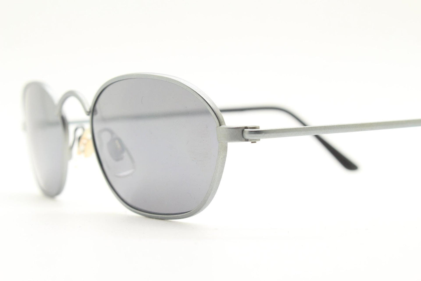 90s vintage small angular oval bug eye sunglasses. Minimal brushed satin finish frame with silver mirror lenses. Y2K. 2000s. Unworn NOS