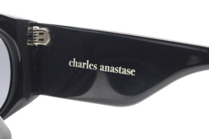 Charles Anastase for Linda Farrow Gallery sunglasses. Womens black gloss acetate thick frame design with tall arms and swans. NOS vintage