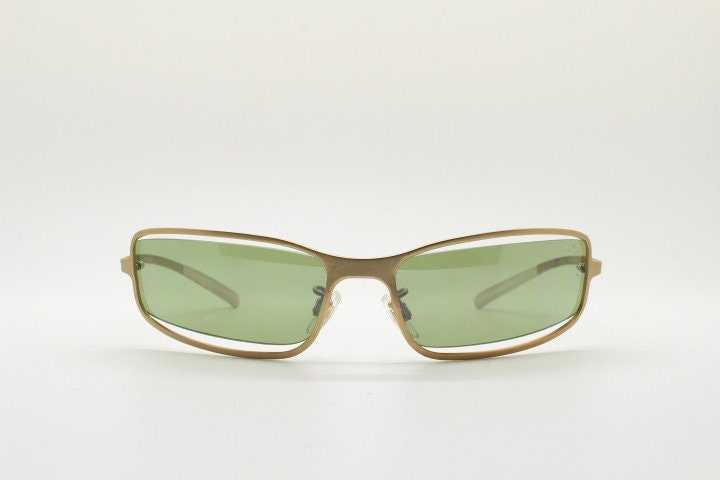 Y2K vintage wraparound sunglasses. Low profile satin finish golden slender frame with green lenses and gap feature. 2000's. 90s. NOS