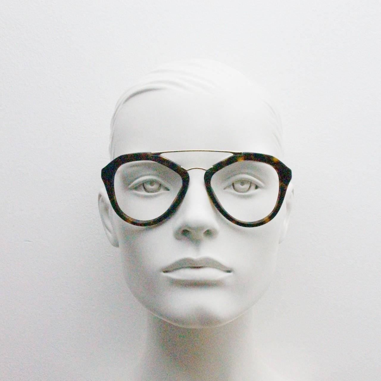 Prada angular eye glasses made in Italy. Thick tortoise acetate optical frames with prominent gold double bridge. Prescription. RX