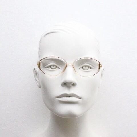 Silhouette 80s vintage oval eye glasses made in Austria. Transparent crystal optical frame with giraffe arm print. Prescription RX