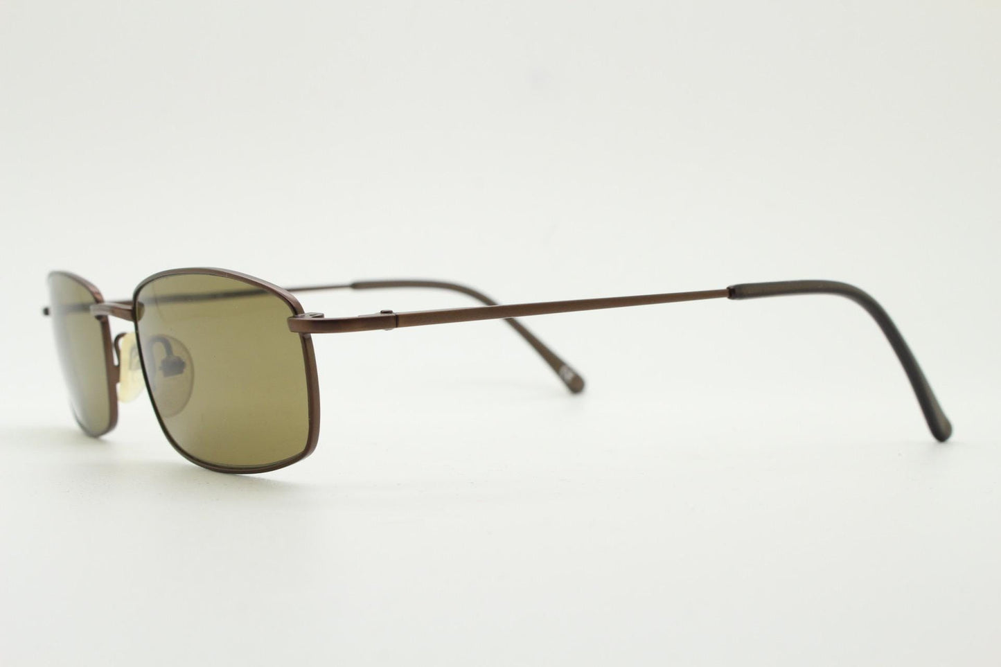 90s vintage rectangular low profile metal sunglasses. Minimal slim metal frame in satin bronze finish with plain brown lenses. NOS. BNWT