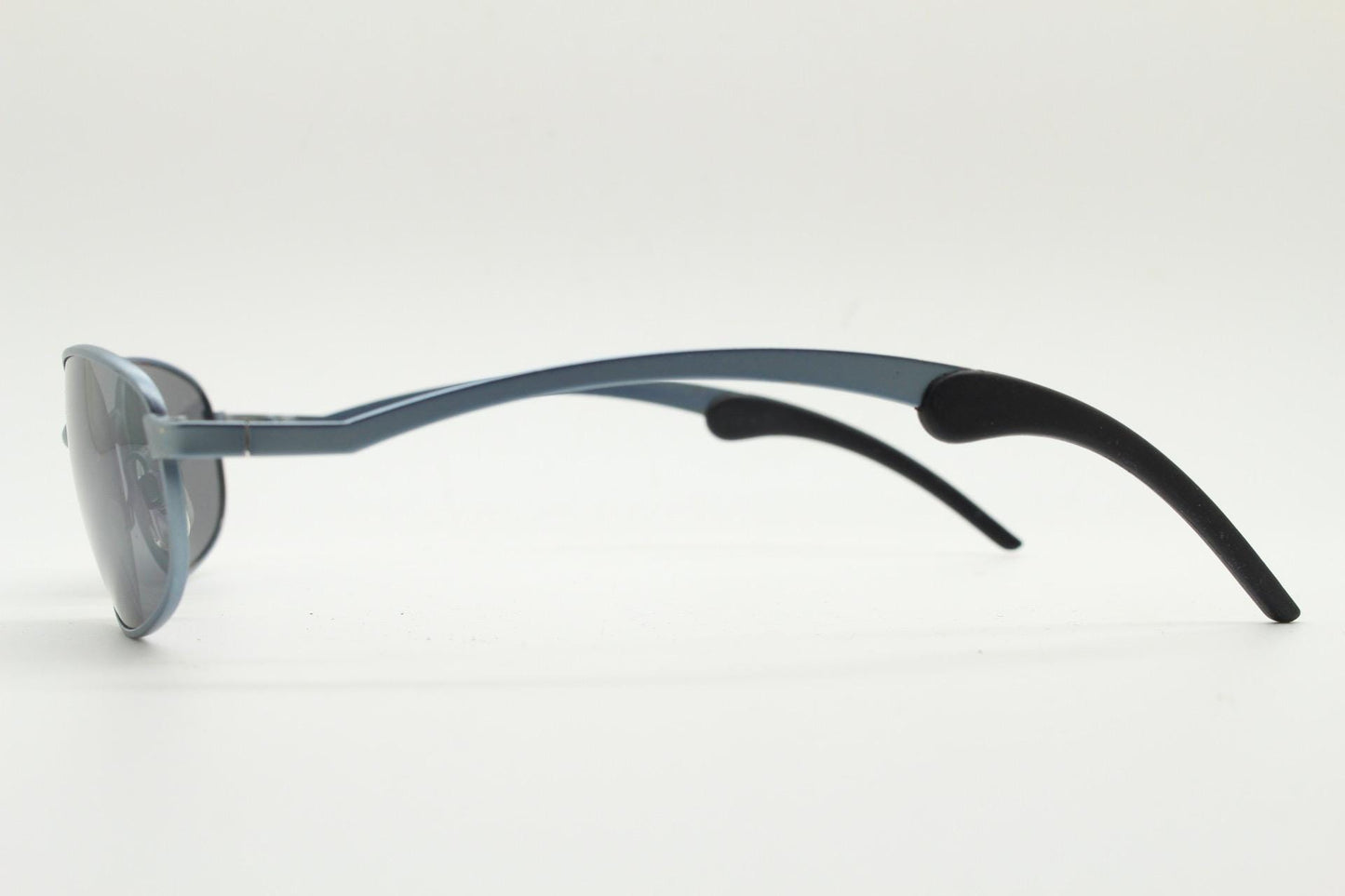 90s vintage oval small bug eye sunglasses. Curved blue satin finish solid metal frame with stylised arched arms and rubber ends. Unused NOS